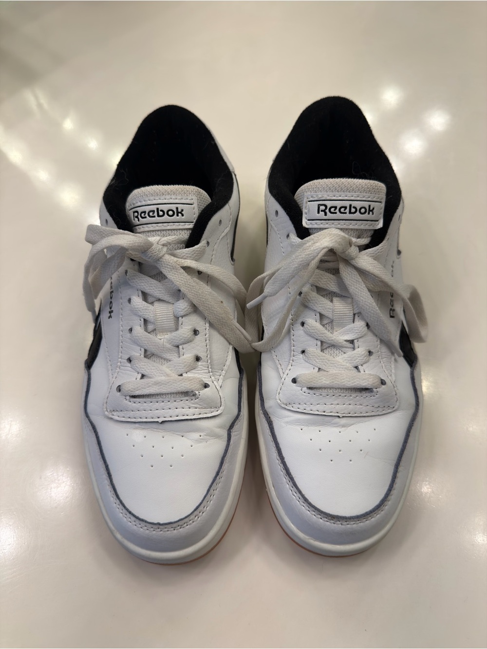 Reebok Woman’s White and Black Low-Top Leather Sneakers